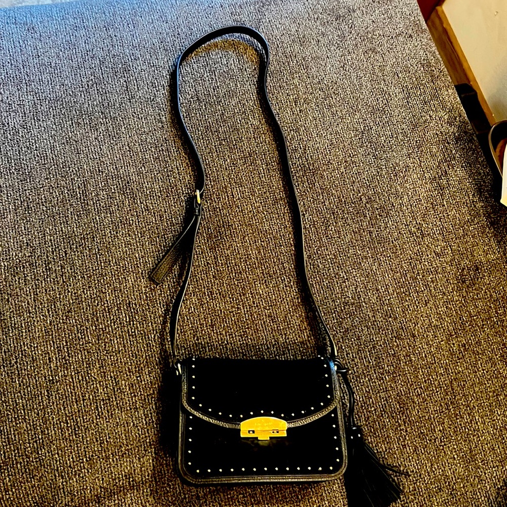 Gently used Kate spade black suede crossbody. Small scratches on buckle pictured